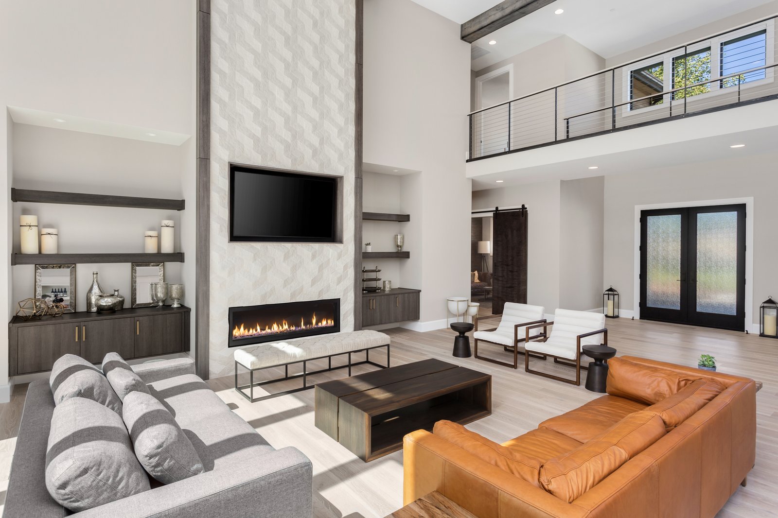Forestview + Estate dual-story great room by Reschka Design Build