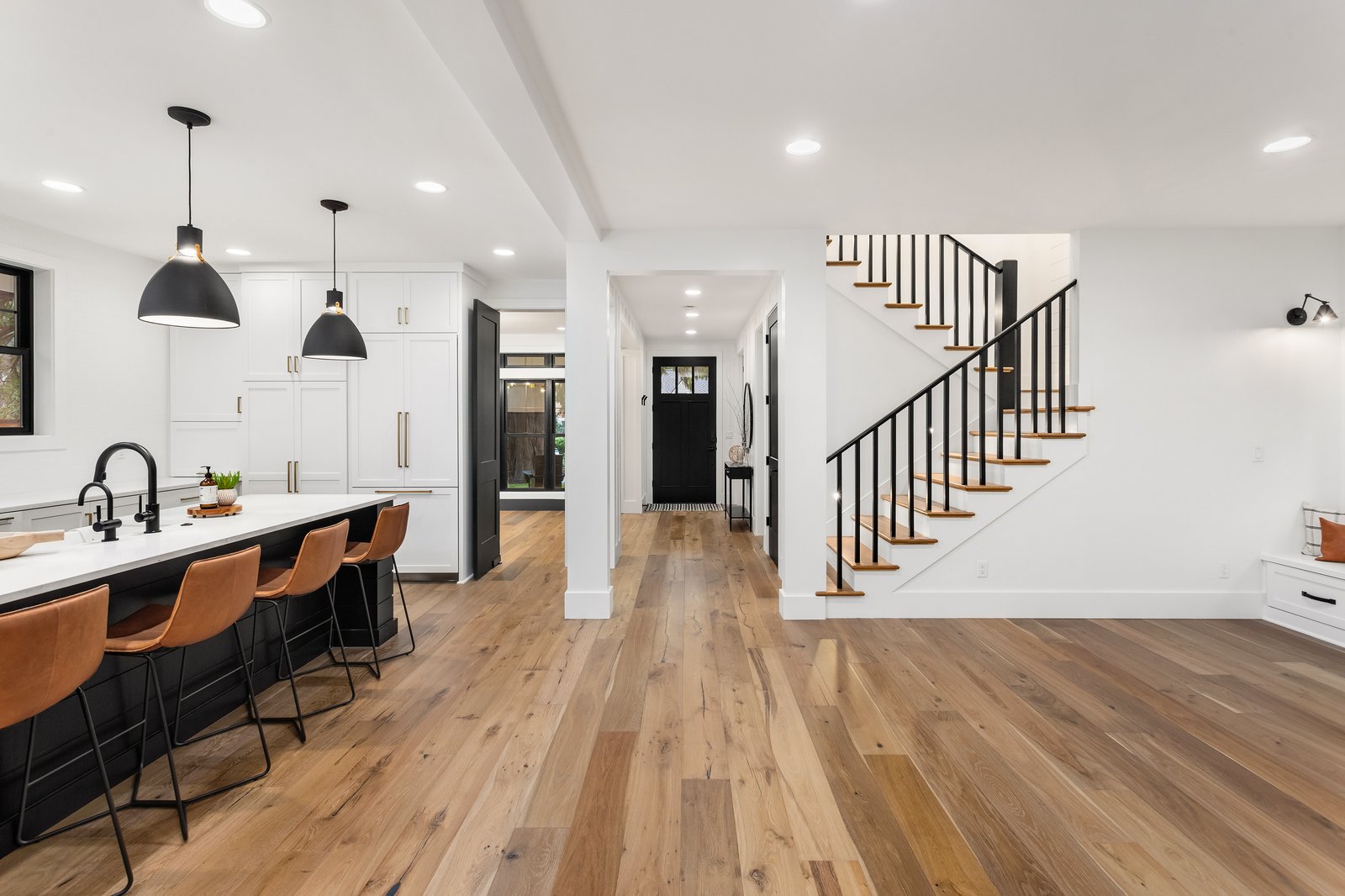 Lakeside + Addition open living room by Reschka Design Build
